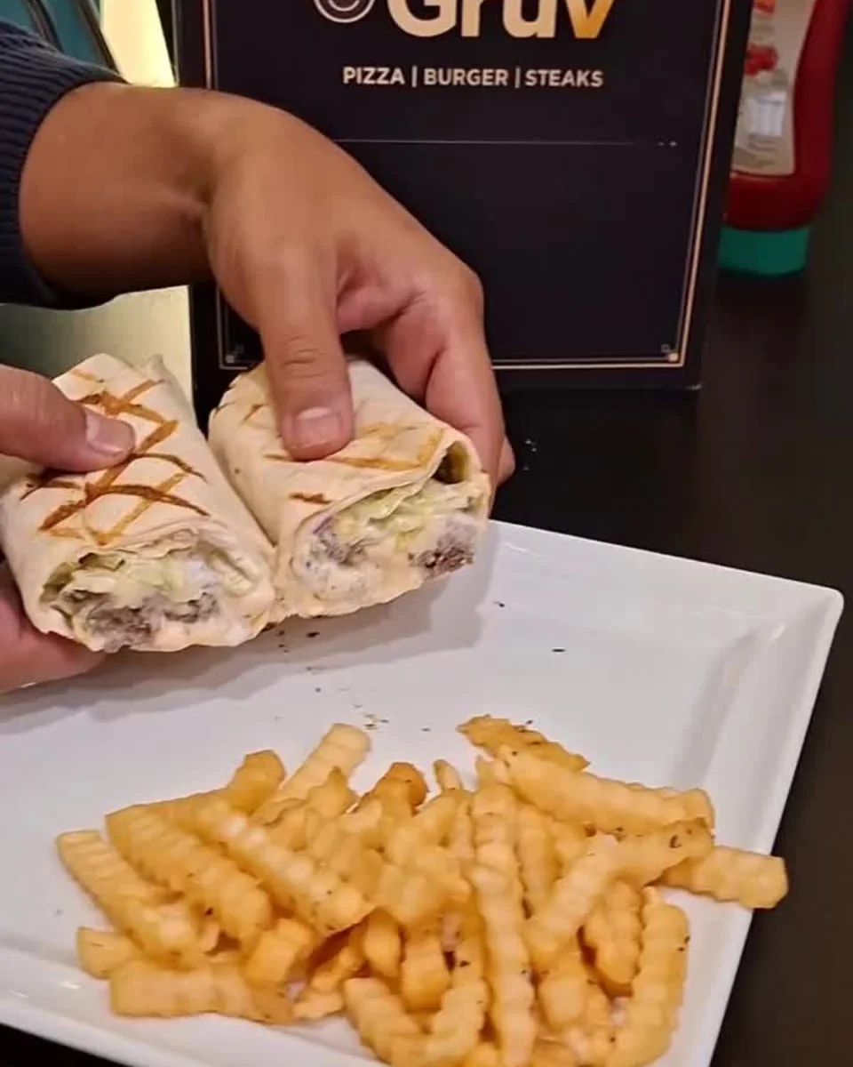 A close-up of Grüv's Rare Bull wrap from the restaurant's own food reel